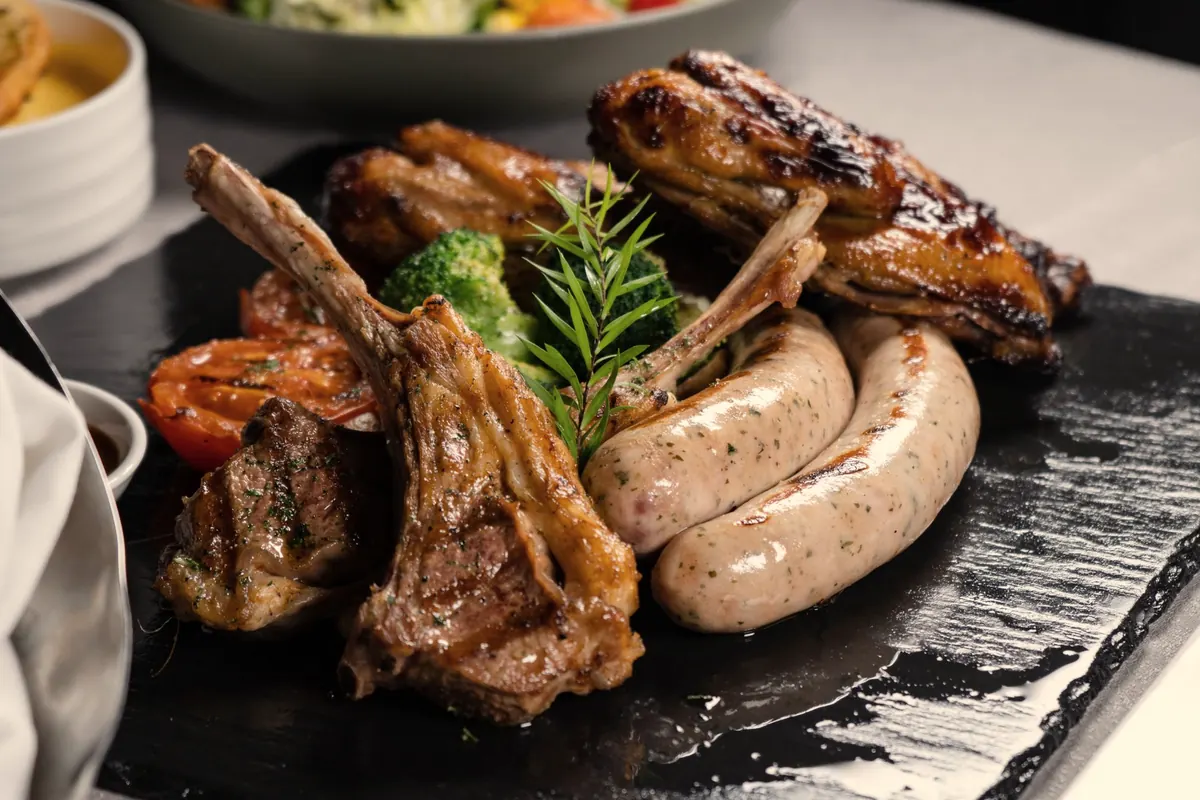 Lamb chops and boerewors on a slate board